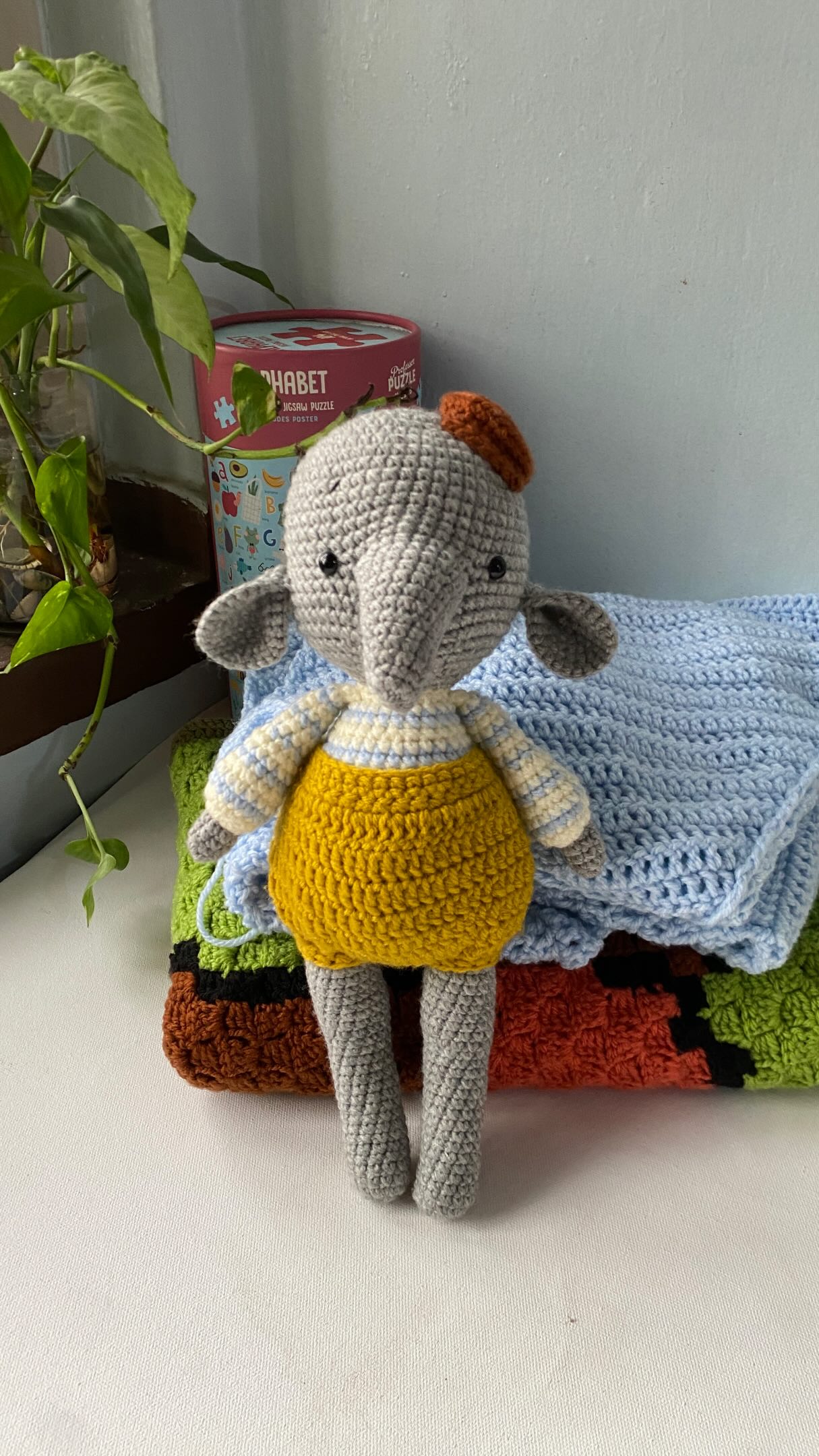 Crochet elephant toy with removable clothes